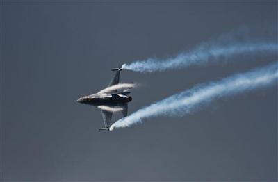 F16 and contrails in the clouds